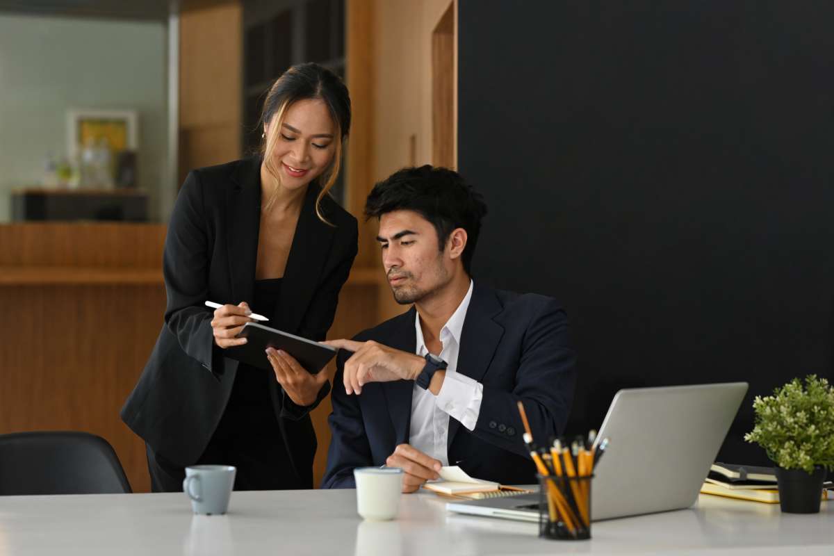 Financial professionals looking at document